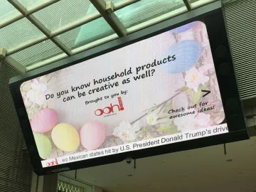 Large indoor LED screen displaying presenter at Singapore conference or event hall installed by Auronova