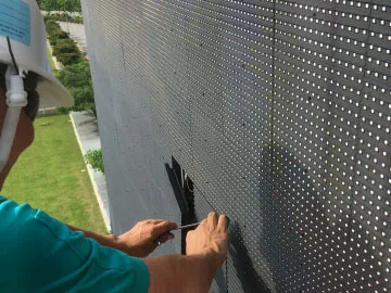 Auronova installation team using aerial work platform to install large outdoor LED billboard display in Singapore